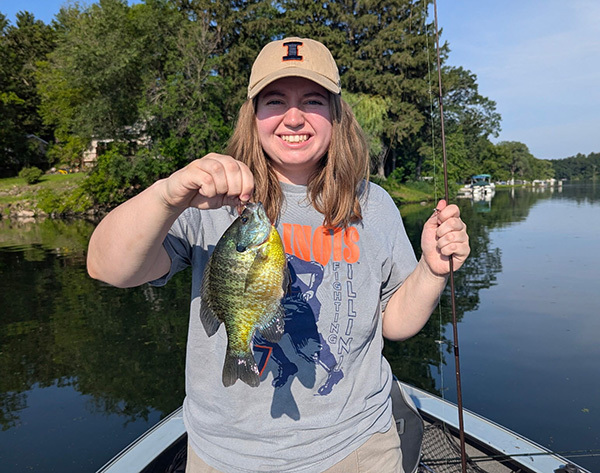 Alyssa holding a big bluebill she caught