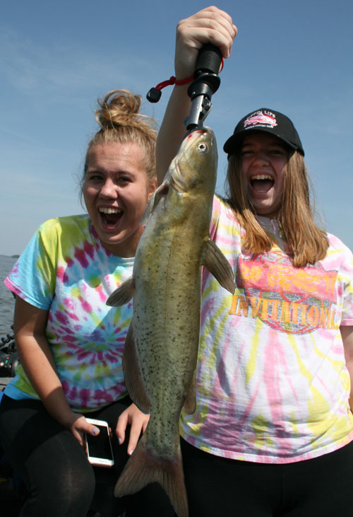 Walt's daughters Ashley and Alyssa are happy with every fish they catch...even a catfish!