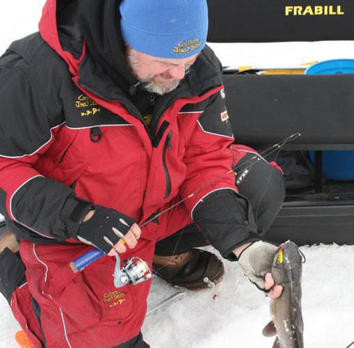 bob pulling catfish out of ice