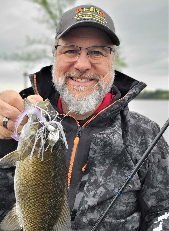 Walt with a smallmouth bass caught with chatterbait