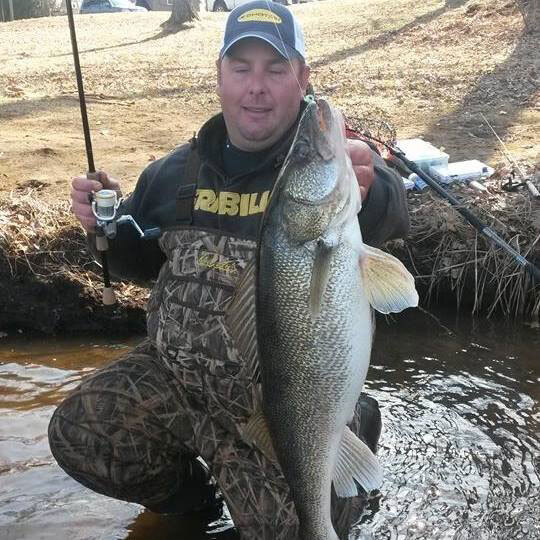 Jessie holding up a big walleye
