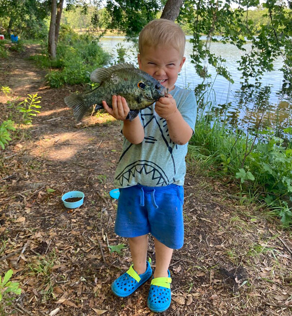 Kid showing off his bluegill
