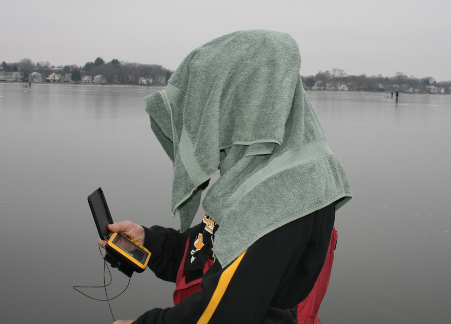 Custom Jigs & Spins pro Kevin Fassbind searches for active fish with his micro camera! (Towel on head keeps out the sun's glare while looking stylish!)