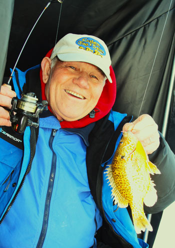Poppee holding up a fish. We miss Poppee!