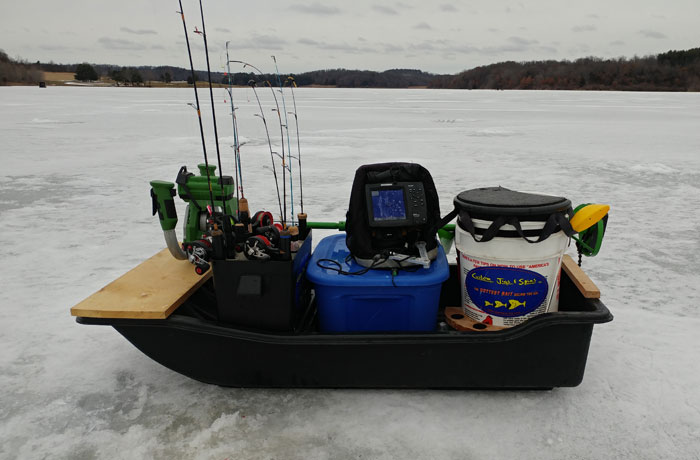 a fully loaded sled for ice fishing