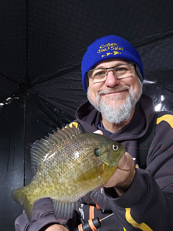 Walt holding up a bluegill