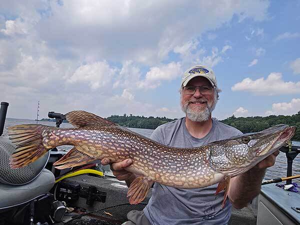 Walt with a BIG Pike he caught with The Worm