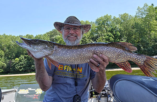 Walt holding a big pike
