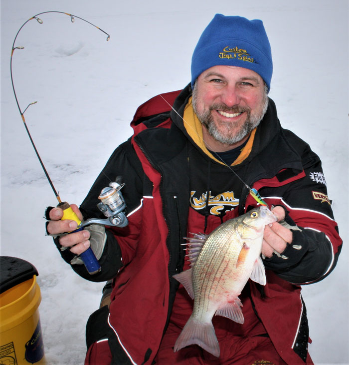 Walt on the ice with a pretty crappie he caught with an ice jig and soft plastic