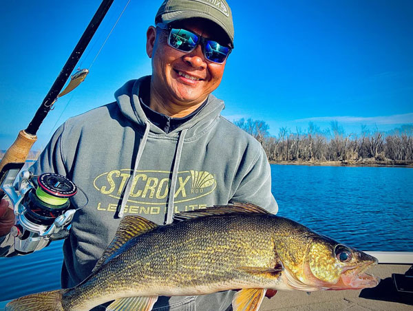 Yauk holding a big walleye he caught with a B3 blade bait